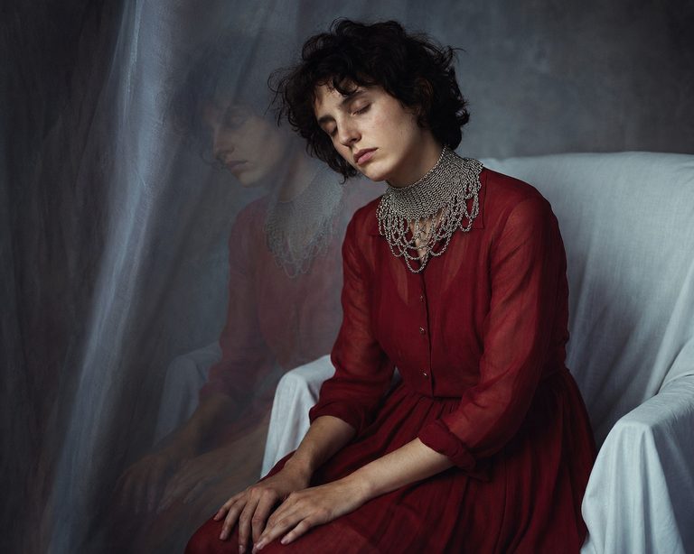 Model wearing a fine-knit chain collar